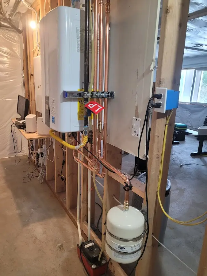 Licensed plumber repairing a kitchen sink in Ashland